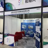 SYX Die Casting exhibition booth showcasing branding and product brochures at the expo